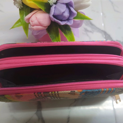 Ethnic wallet with colorful geometric patterns and wrist strap