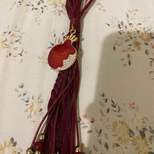 Red charm with pomegranate like new