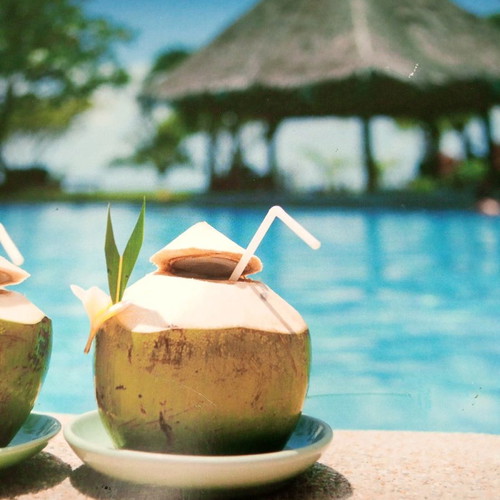 Wooden frame used with tropical pool and coconut motif