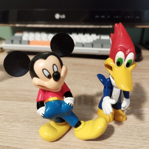 Mickey Mouse and Woody figures like new