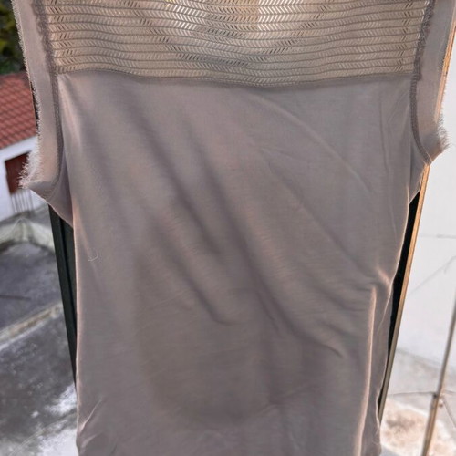 Women's sleeveless blouse gray like new, size small with studs and holes