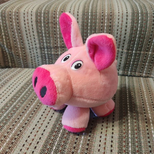 Plush pig used with velvet texture and curled tail