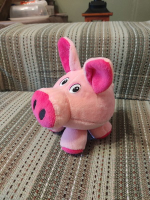 Plush pig used with velvet texture and curled tail