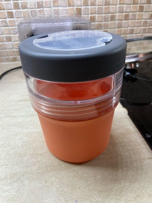 Taper like new with two compartments and plastic spoon