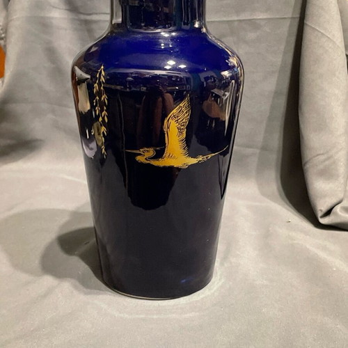 Old porcelain vase dark blue with gold designs used