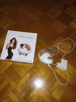 Body Tone massage machine like new with charger and cable