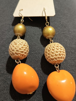 Dangling earrings new with orange, beige, and gold beads