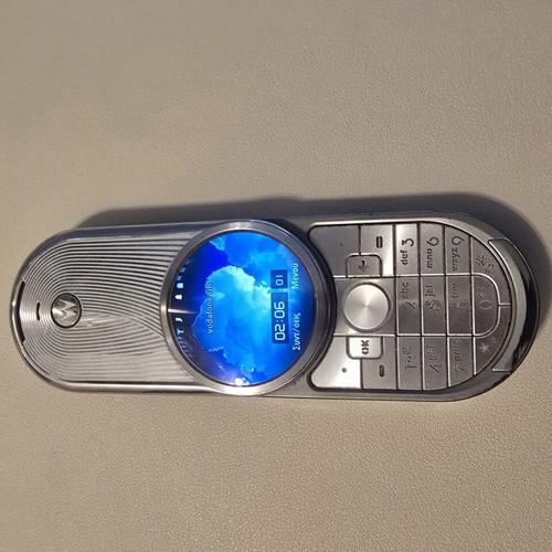Motorola Aura phone like new, silver with spare battery and charger