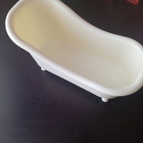 Decorative plastic vintage bathtub organizer used