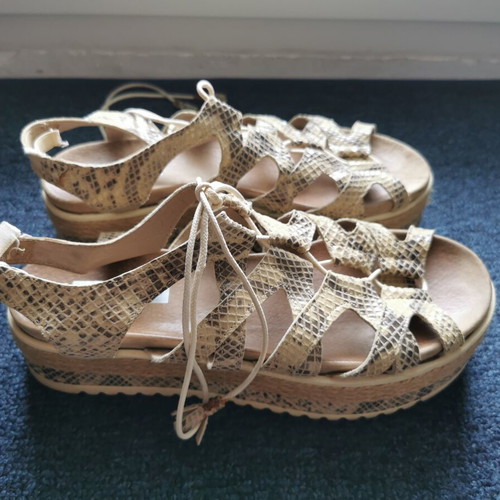Animal print leather flatforms used, size 38, black and beige