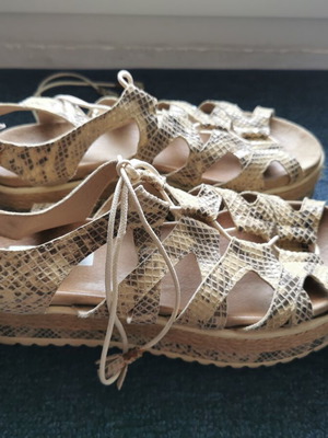 Animal print leather flatforms used, size 38, black and beige