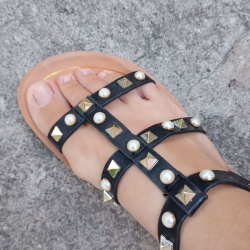 Brilliant black flat sandals with studs and pearls