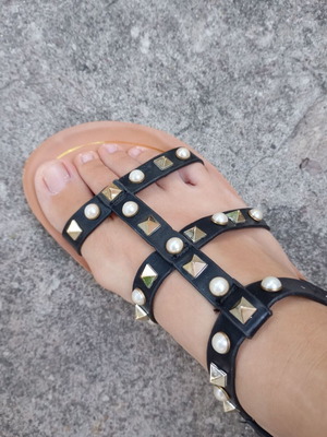 Brilliant black flat sandals with studs and pearls