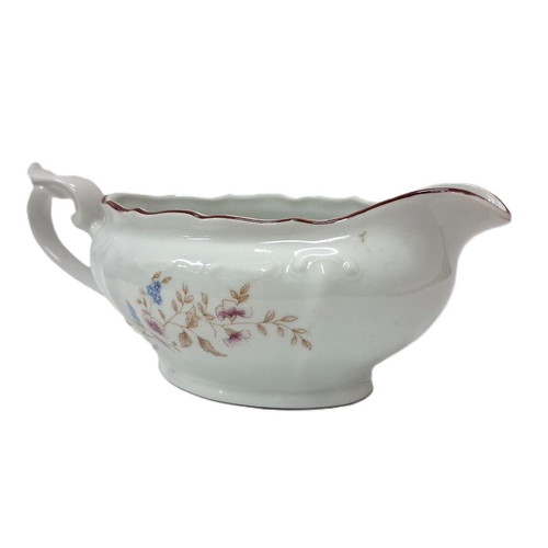 Vintage porcelain sauceboat with floral motif like new
