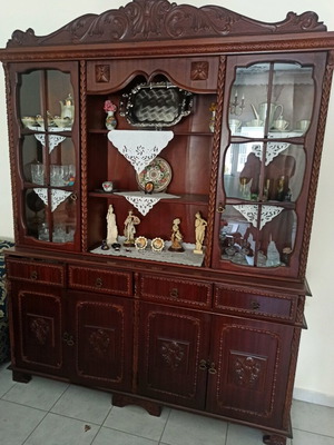 Living room cabinet used with display case and carvings