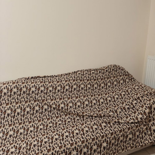 Sofa throw used with small hole