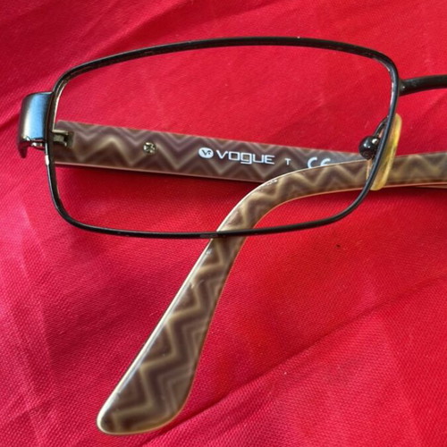 Vogue eyeglass frame like new with black and printed design