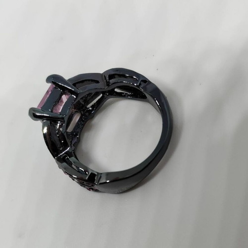 Ring with pink crystal and black base like new