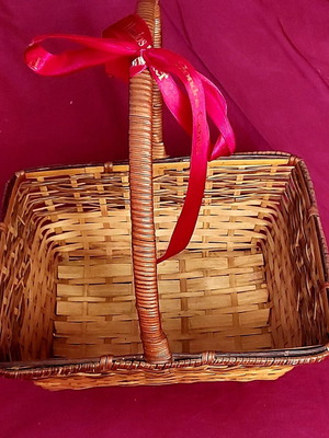 Handmade wicker basket used with red ribbon