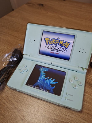 Nintendo DS Lite Turquoise like new with Pokemon accessories