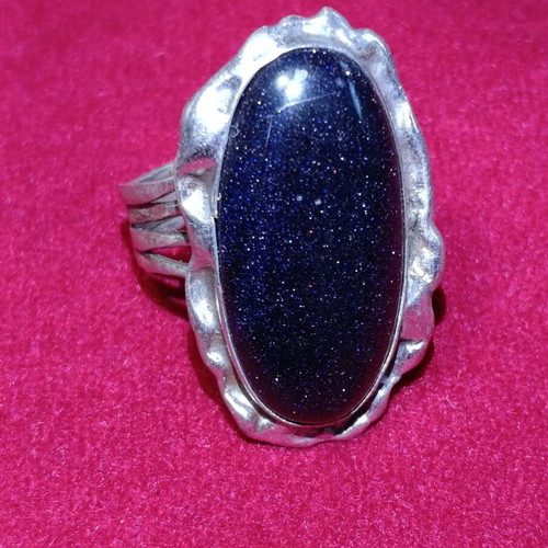 Silver ring with oval blue goldstone stone used