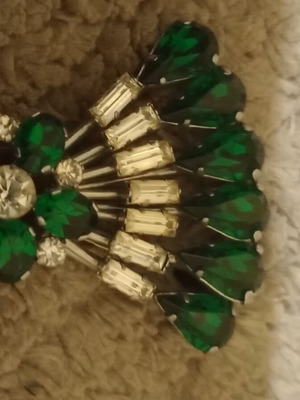 Vintage brooch with green and white crystals used