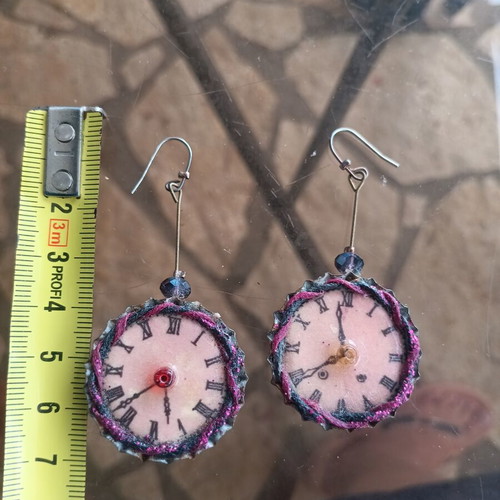 Clock earrings used, long and impressive