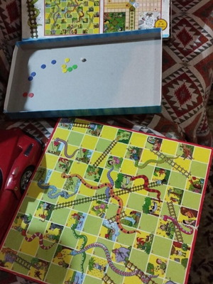 Snakes & Ladders and Ludo board games used, with worn box