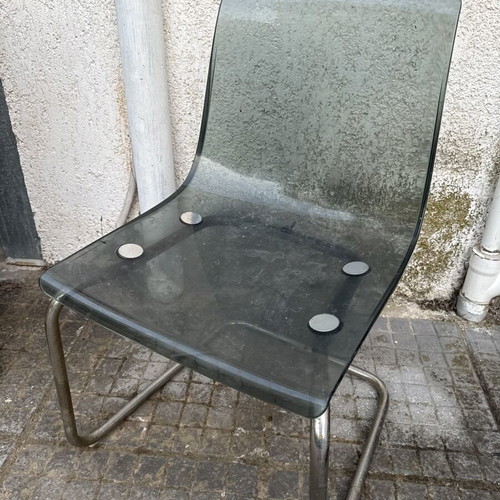 Transparent chair with tinted seat and chrome metal frame