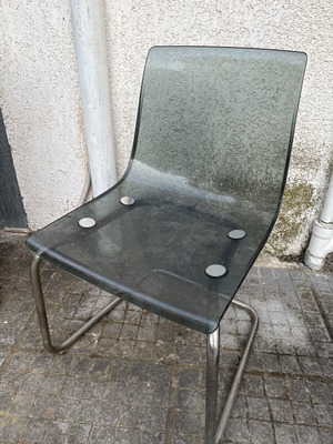 Transparent chair with tinted seat and chrome metal frame