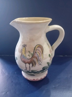Ceramic jug used with plant and animal motif