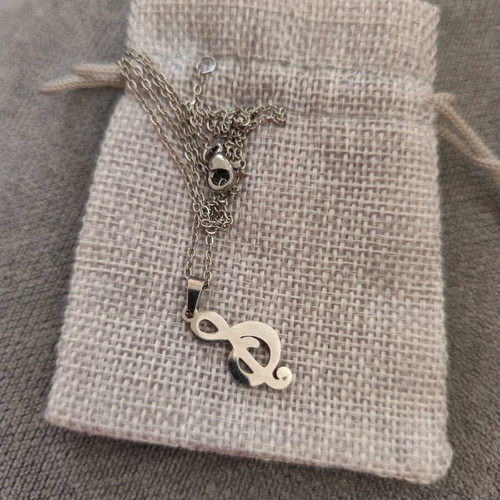 Treble clef necklace