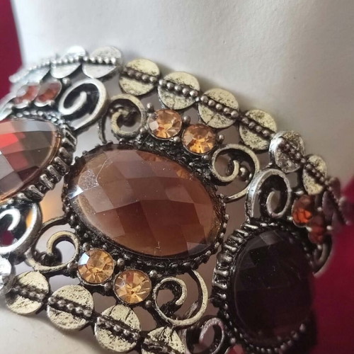Vintage cuff bracelet with large brown stones and decorative details
