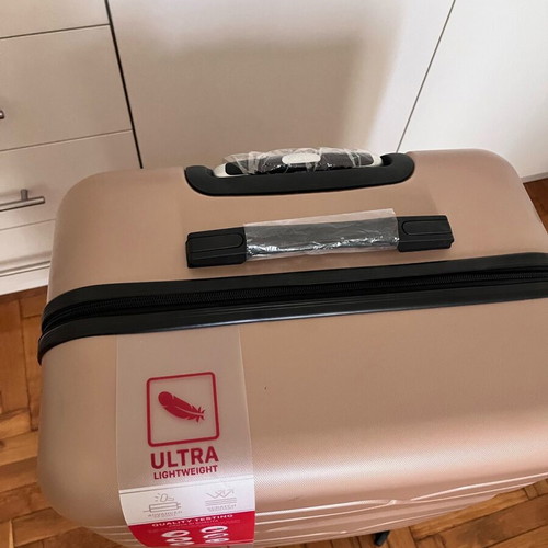 Suitcase new, unused, salmon color with lock and wheels