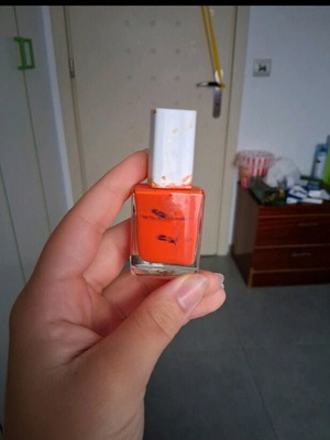 Orange nail polish used