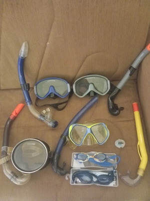 Snorkeling set like new with 4 masks, 5 snorkels, 2 goggles, and 2 nose clips