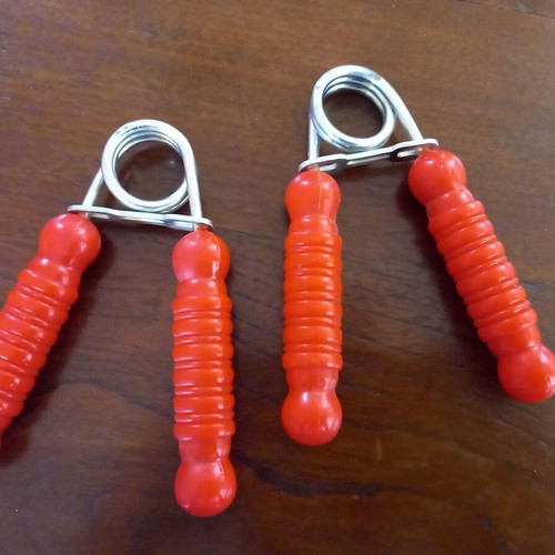 Set of 2 hand grip strengtheners used, red