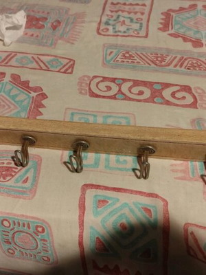 Wooden hanger with eight metal hooks like new