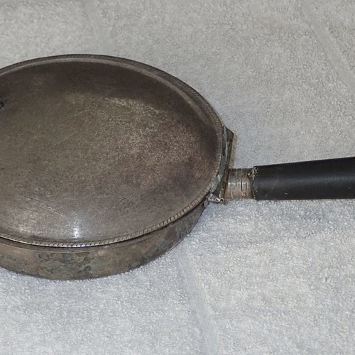 Antique heating vessel used for bed