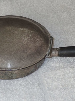 Antique heating vessel used for bed
