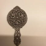 Carved old hand mirror used