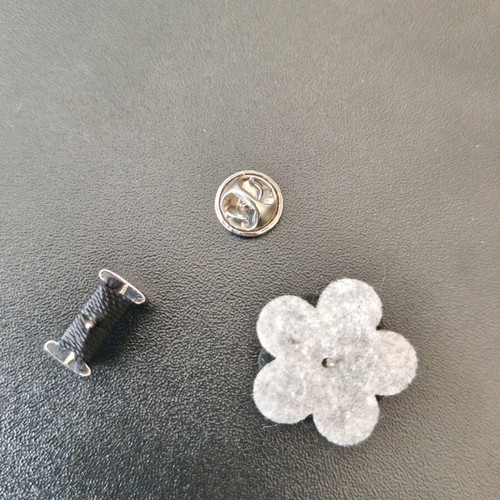 Set of two men's lapel pins like new, black and silver