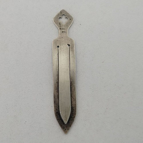Silver bookmark with cross-shaped handle, used