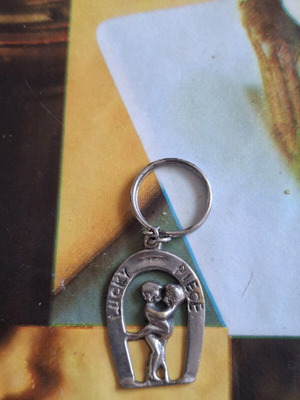 Metal keychain like new, man and woman design
