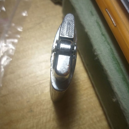 Penguin petrol lighter used, collectible