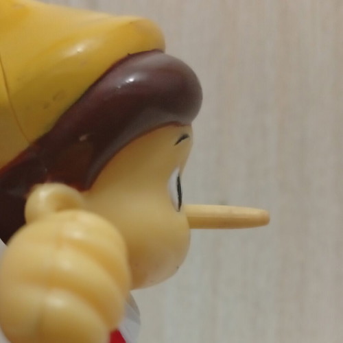 Pinocchio figure with nose mechanism, used