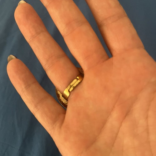 Ring adjustable size, like new, black and gold