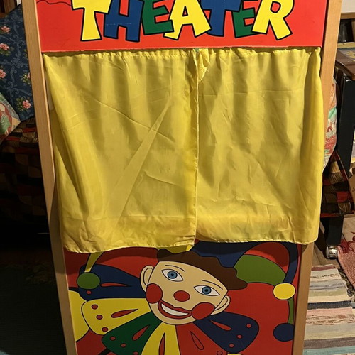 Used puppet theater with wear and missing support side