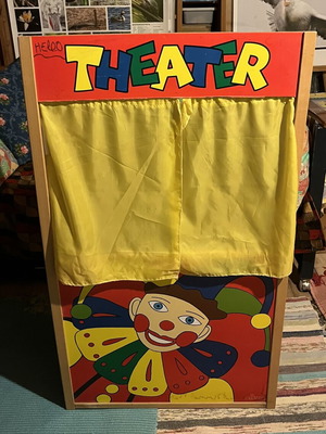 Used puppet theater with wear and missing support side