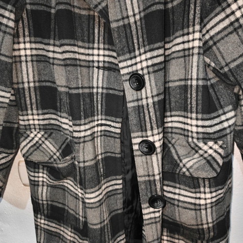 Checked coat with high collar, pockets and buttons
